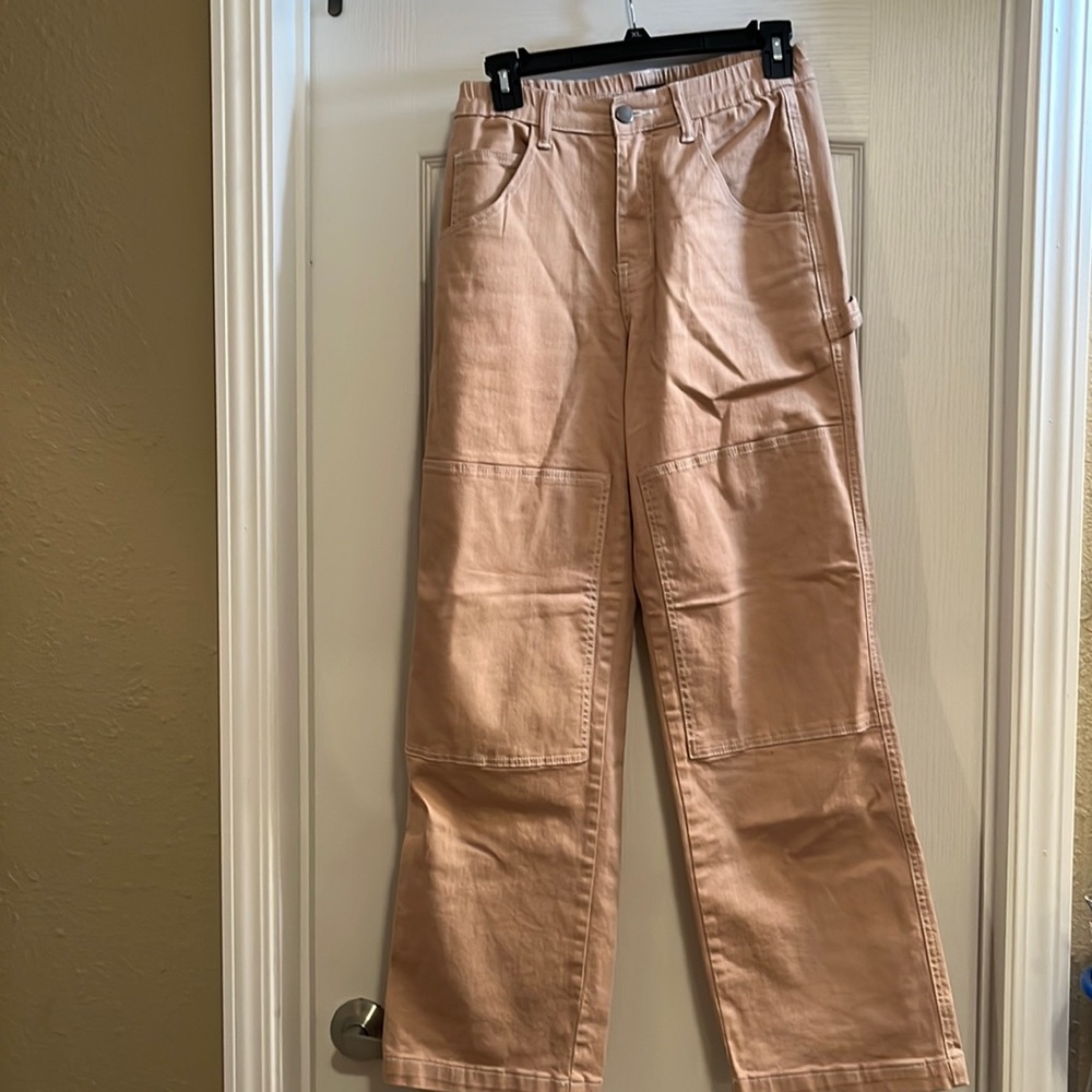 Rue21 flare and wide jeans that are a size Medium and have a beige/ tan  color.